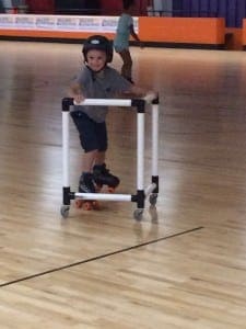 Seneca Peterson gets tha hang of skating during the Walk Now For Autism Speaks Western New England kick-off July 23 at Interskate 91. (Photo by Hope E. Tremblay)