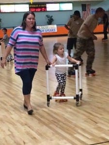 Becca Matthew and her daughter Carleigh take a turn around the skating rink during the Walk Now For Autism Speaks Western New England kick-off July 23 at Interskate 91. (Photo by Hope E. Tremblay)