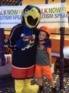 Owen McIsaac joins Springfield Falcons mascot Screech during the Walk Now For Autism Speaks Western New England kick-off July 23 at Interskate 91. (Photo by Hope E. Tremblay)