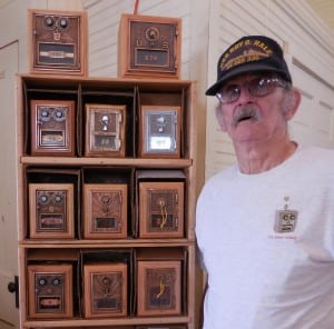 Retired mail carrier William Mikuski of Blandford displayed his unique handcrafted coin banks made from original post office lockbox doors. (Photo by Amy Porter)