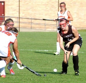 Westfield's Leighanne Sullivan, right, eyes the ball in a 2014 contest at Agawam High School. The senior captain, Sullivan figures to play a key role on the Bombers this season. (Photo by Fred Gore)