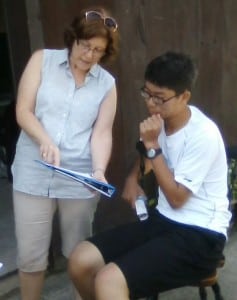 Dr Teresa Benedetti working with Peijie "Peter" Gao on a report.