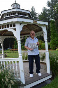 Fred Bozek, who donated the funds to purchase a gazebo at Stanley Park to remember his wife of more than 50 years, is seen holding his wedding party photo.