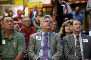 State Sen. Andrew Hosmer, D-Laconia, center, attends the unveiling of a new plan for the Northern Pass hydro power project at Globe Manufacturing Co. in Pittsfield, N.H., on Tuesday, Aug. 18, 2015. Afterwards Hosmer expressed his support for the project. (Paul Hayes/The Caledonian-Record) 