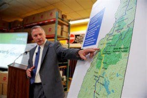 Bill Quinlan, President of Eversource Operations in New Hampshire, presents revised plans for the Northern Pass hydroelectric project at Globe Manufacturing in Pittsfield, N.H., on Tuesday, Aug. 18, 2015. The new "Forward NH Plan" calls for an additional 52 miles of buried power lines through the White Mountains National Forest. (Paul Hayes/The Caledonian-Record)