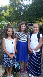 Neighborhood 5th graders Abbie Balser, Sydney Blackak, and Gabriella Grabiec. Photo bomber Dylan Gibson