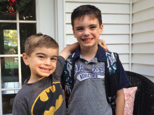 Beckett VanHeynigen (left) wishes his brother Lincoln well on his first day at Paper Mill School.