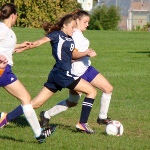 Westfield Technical Academy and Hampden Charter School of Science (8) battle for the ball Thursday at Jachym Field. (Photo by Chris Putz)