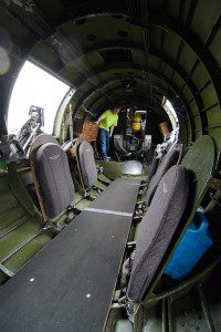 Ryan and Christine O’Connor of Springfield inspect the cramped quarters of the B-17G Liberator bomber from World War II.(Photo by Marc St. Onge)