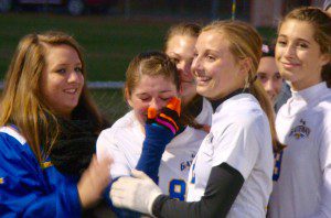 Gateway Regional girls' soccer senior Joanna Arkoette, center, shares an emotional moment during a pregame ceremony on "Senior Night" Friday in Huntington. (Photo by Chris Putz)