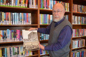 Dr. Robert Brown will present a lecture titled “A History of Downtown Westfield” on Nov. 18 at the First United Methodist Church. He is seen here showing the Professional Building on Elm Street in the early 1950’s and when it was destroyed by fire in 1952. (Photo by Lori Szepelak)