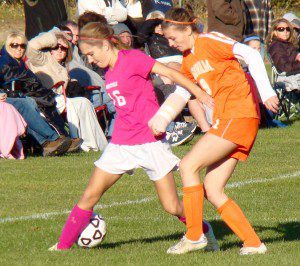 Westfield’s Madison Pelletier, left, attempts to possess the ball while holding off Agawam’s Bailey Laviolette Friday. (Photo by Chris Putz)