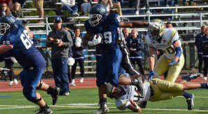 Travon Holder leaves Mass Maritime defenders in his wake on one of his three touchdown runs on Saturday (Kiley Berube photo)