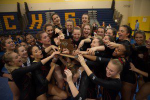 The Westfield Bombers celebrate their ninth straight West Sectional Gymnastics Championship Saturday night at Chicopee Comprehensive High School. (Photo by Marc St. Onge)