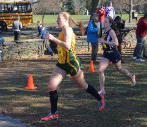 Holyoke Catholic senior runner Julie Carroll, of Southwick, crosses the finish line at Saturday's state cross country championships at Stanley Park. (Photo by Lynn F. Boscher)