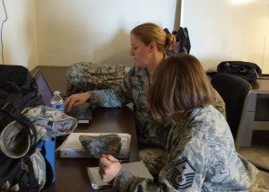Maj. Wendy Kiepke, Logistics Readiness Officer, and 1st Sgt. Marnie Wallace review logistic actions and priorities. (Photo by Maj. Mary Harrington)