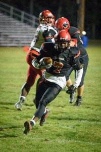 Westfield junior running back Wilton Royal rushes past the Commerce defense Friday night at Bullens Field. (Photo by Marc St. Onge)