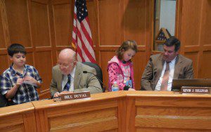 Russell Elementary third-graders Cyler Sqroi and Emma Gillis demonstrate ST Math on their IPads to Westfield School Committee members Bill Duval and Kevin J. Sullivan at Monday's meeting. (Photo by Amy Porter)