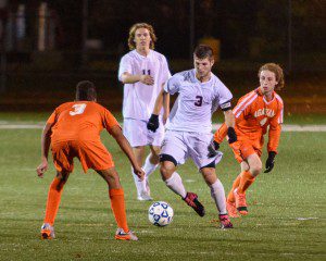 Westfield senior Matt Butera (3) bobs and weaves through the Agawam defense during a West Sectional Division 1 boys' soccer semifinal Thursday night at Central High School in Springfield. (Photo by Marc St. Onge)