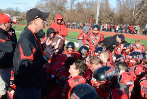 The Westfield Youth Football Junior Bombers listen to their coach. (Photo by Lynn F. Boscher)