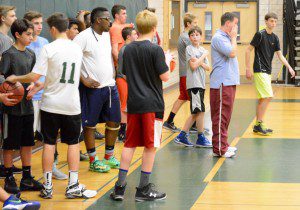Southwick High boys' hoops coach Dylan Dubuc stands in front of the Rams' players during a practice session Tuesday. (Photo by Chris Putz)