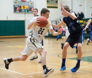 A Panther player attempts to cut off the Rams' offensive drive Tuesday night. Palmer halted Southwick's three-game winning streak to begin the 2015-16 regular season. (Photo by Bill Deren)