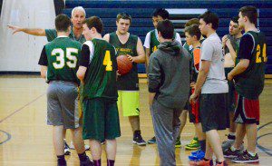 St. Mary High School boys' basketball coach Joe Molta instructs his players during practice Thursday at Westfield Middle School South. (Photo by Chris Putz)