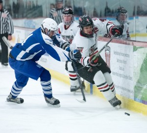 Westfield gets the jump on West Side in this matchup Friday at Amelia Park Ice Arena. The Bombers posted a convincing 7-0 shutout. (Photo by Bill Deren)