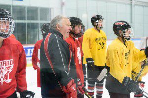 Longtime Westfield High School boys' ice hockey coach C.B. "Moose" Matthews and the Bombers get ready for their season opener at Wednesday's practice. (Photo by Chris Putz)