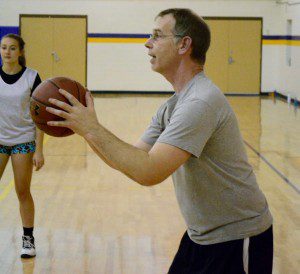 Westfield Technical Academy girls' basketball coach Matt Seklecki instructs his players during Wednesday's practice session. (Photo by Chris Putz)