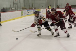 St. Mary gets the jump on the puck against Easthampton Saturday at Amelia Park Ice Arena. (Photo by Marc St. Onge)