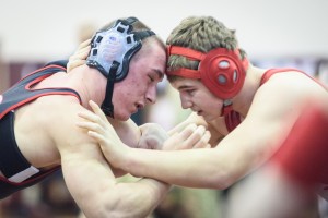 Westfield knocked heads with competition from all over in the Burt Burger wrestling tournament Saturday at Chicopee High School. The Bombers continued to battle, rallying from an 18-point deficit against South Hadley Wednesday night to forge a hard-fought 36-36 tie. (Photo by Marc St. Onge)