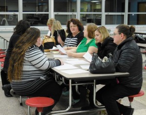 Parents and residents broke into small groups to discuss questions for the superintendent search process at a forum on Thursday held by the School Committee. (Photo by Amy Porter)