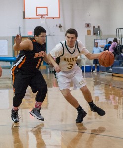 St. Mary's Kevin Rockwal, right, attempts to drive past Lee. (Photo by Bill Deren)