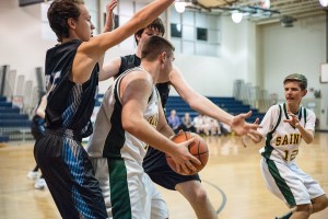 St. Mary attempts to swing the ball around the Franklin Tech defense, which swarms to the ball Tuesday night at Westfield Middle School South. (Photo by Bill Deren)