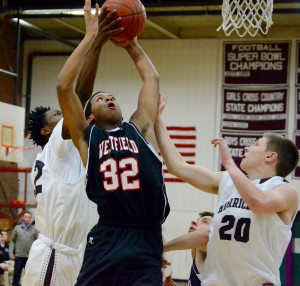 Westfield’s Luis Castro (32) goes up strong with Amherst. (Photo by Chris Putz)