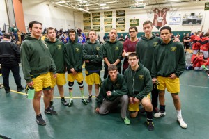 Members of the Southwick-Tolland Regional High School wrestling program stop to pose for a team photo. Pictured from left to right are: Braydon Tingley, Trevor Desruisseaux, Jake Walker, Joshua Sylvia, Miguel Gonzalez, Connor Stevens, Nolan Labrecque and Obimla Ezeugwu. Eddie Martinez and Tyler Orban kneel in front. (Photo by Marc St. Onge)