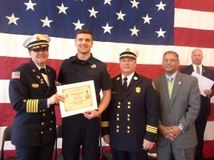 Westfield Fire Chief Mary Regan awards Firefighter David Albert with his diploma. They are joined by Acting State Fire Marshal Peter Ostroskey and State Rep. Jose Tosado D-Springfield. (Photo by Dennis Hohenberger)