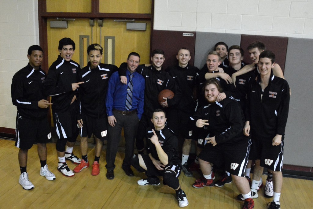 The Westfield High School boys' varsity basketball team shares a fun moment prior to Monday night's game at Chicopee. Bombers' first-year head coach Joe Balestracci stands fourth from left. (Photo by Lynn F. Boscher)