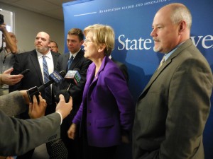 U.S. Senator Elizabeth Warren answers questions from reporters after meeting with students at Westfield State on Monday. Also present were Rep. Don Humason, Rep. John Velis, and Westfield Mayor Brian P. Sullivan. (Photo by Amy Porter)