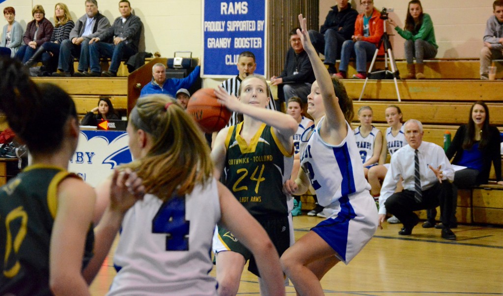 Southwick’s McKinley White (24) attempts to put up a shot against Granby Monday night. (Photo by Chris Putz)
