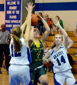 Southwick’s Katelyn Sylvia (4) drives strong to the hoop against Granby. (Photo by Chris Putz)