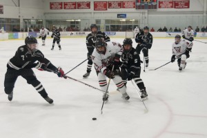 Westfield's Max Maggipinto attempts to split the Longmeadow defense during Wednesday night's boys' ice hockey Berry Division contest at Amelia Park Ice Arena. (Photo by Marc St. Onge)