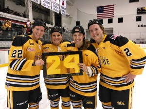 Kacey Bellamy (22), left, and her fellow Boston Pride players strike a pose for their injured teammate - #24's Denna Laing - after winning the NWHL's first-ever Isobel Cup Finals Saturday night at the Prudential Center in Newark, N.J. (Submitted photo)