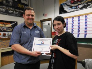 David Tefft, SkillsUSA advisor at Westfield Technical Academy, presents a certificate to Dominique Rogers for participating in the regional competition. All of the students received certificates, and thirteen medalled at the regional contest. (Photo by Amy Porter)