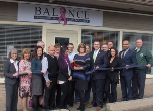 Balance Cancer and Wellness Salon and Boutique owner Susan Manolakis, center, is flanked by town and state officials Friday as she cut the ribbon at the grand re-opening of her salon at 535 College Highway, Southwick. (Photo by Lynn Bosher)