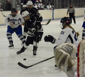 Longmeadow’s Madison Pelletier, center, takes a shot against Methuen-Tewksbury in the 2015-16 girls' ice hockey tournament. The two teams will meet again this Saturday at Gallo Arena in Bourne to determine who gets to advance to the frozen Final Four. (Photo by Chris Putz)