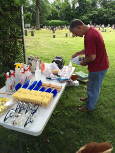 Rick Gaylord assembles the eco-friendly cleaning supplies that are used each year during a clean-up day at The Old Burying Ground.