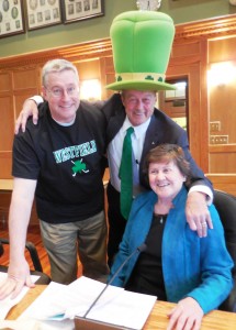 Robert Paul, Sr. (center) came to the City Council meeting dressed for St. Patrick's Day, here with councilors Dave Flaherty and Mary Ann Babinski. (Photo by Amy Porter) 