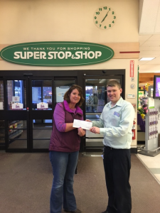 Agawam Super Stop & Shop Assistant Manager Tim Rancourt presents a $2,000 check to Sally Munson for Our Community Food Pantry.